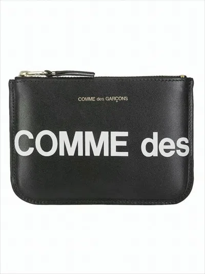 Comme Des Garçons Rectangular Cowhide Clutch With Gold Accents And Typography In White