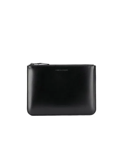 Comme Des Garçons Embossed Logo Wallet In Black