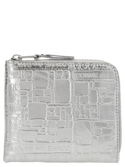 COMME DES GARÇONS SILVER EMBOSSED LOGOTYPE WALLET
