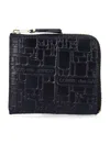 Comme Des Garçons Embossed Logotype Wallet In Black