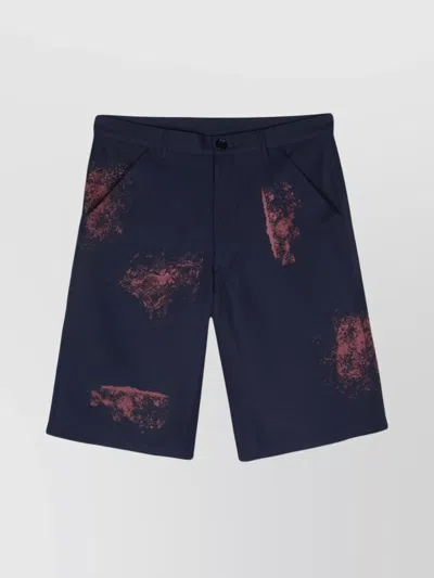 COMME DES GARÇONS SPLATTER PAINTED TWILL SHORTS