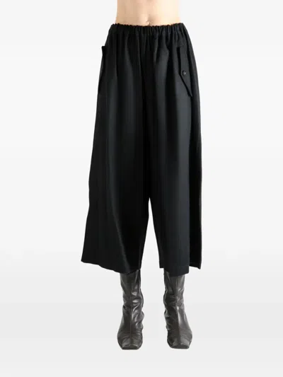 Comme Des Garçons Tao Button-detail Trousers In Black