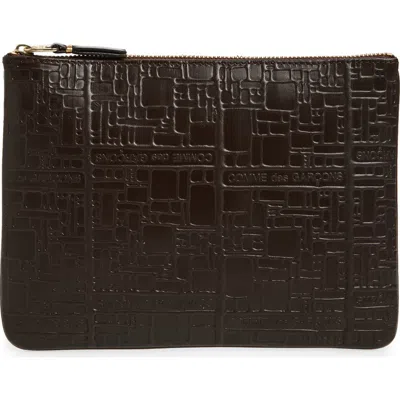 Comme Des Garçons Wallets Embossed Logo Leather Pouch In Brown
