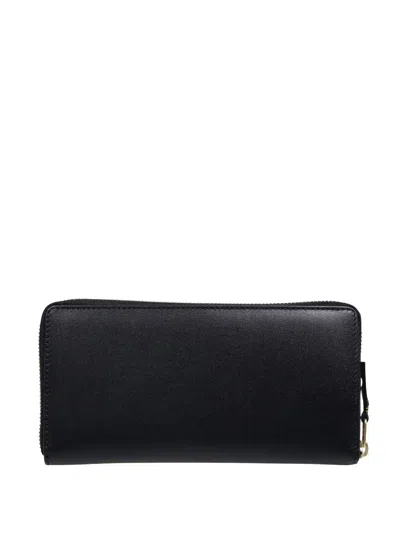 COMME DES GARÇONS ZIP-AROUND LEATHER WALLET