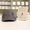 Conscious Ink Lightning Bolt Access Cap + Ink In Brown