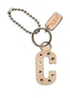 Consuela Iced "c" Bag Charm In Beige In Sand