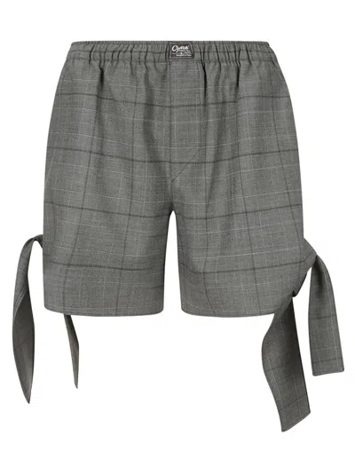 Coperni Knotted Checked Shorts In Grey