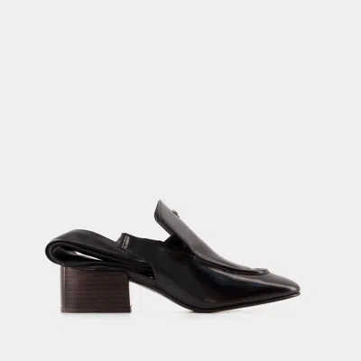 Coperni Logo Plaque Slingback Moccasins In Black