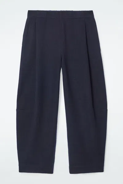 Cos Boiled-wool Barrel-leg Trousers In Blue