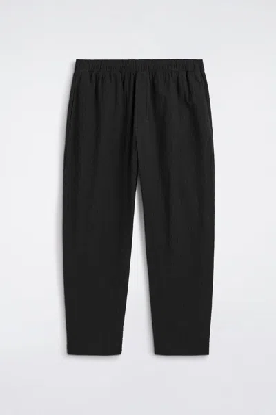 Cos Crinkled-cotton Relaxed-fit Tapered Pants In Black