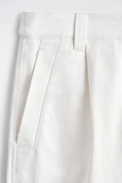 Cos Denim-herringbone Relaxed-fit Tapered Trousers In White