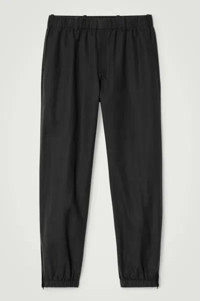 Cos Elasticated Tapered Trousers In Black