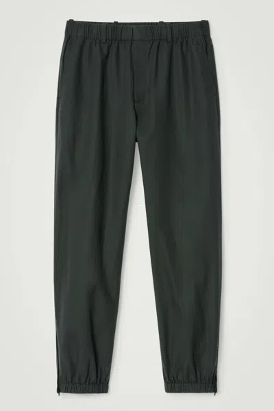 Cos Elasticated Tapered Trousers In Green