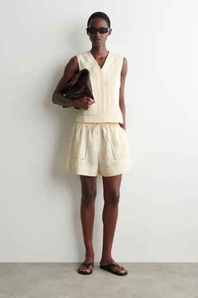 Cos Embroidered-detail Linen Shorts In Yellow In Neutral