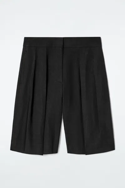 Cos Longline Pleated Linen Shorts In Black