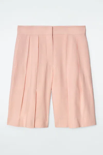 Cos Longline Pleated Linen Shorts In Orange