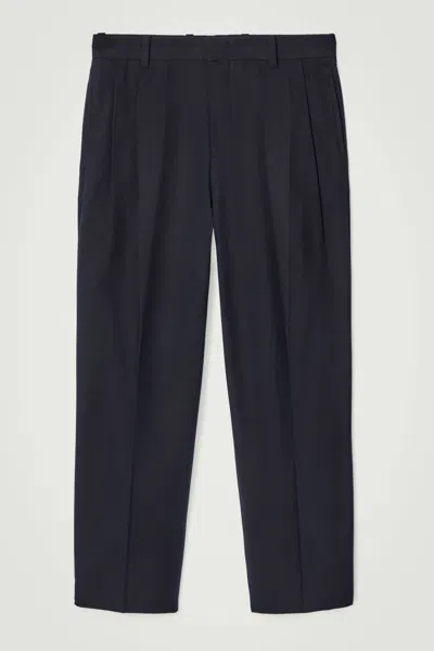 Cos Relaxed Pleated Cotton Tapered Trousers In Blue