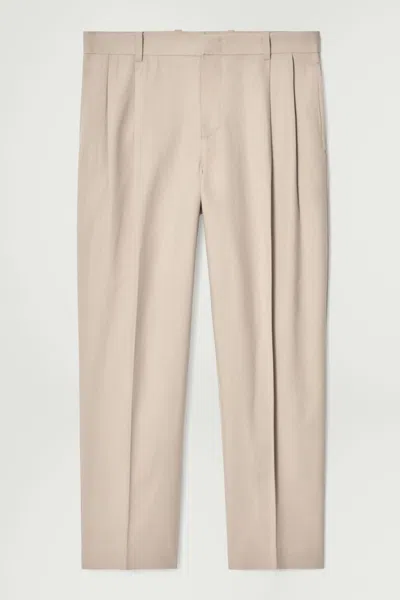 Cos Pleated Cotton Tapered Trousers In Brown