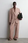 Cos Relaxed Fluid Wide-leg Trousers In Beige In Sand