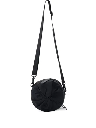 Côte And Ciel Cylindrical Messenger Bag In Black