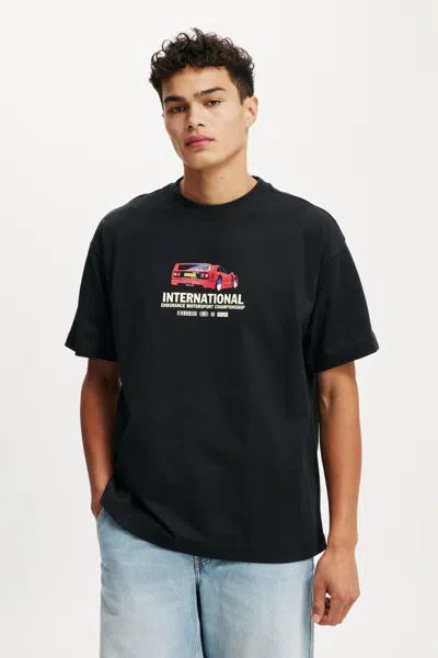 Cotton On Box Fit Graphic T-shirt In Black/international Motorsport