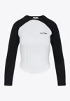 Courrèges Long-sleeved Contrast T-shirt With Rounded Hem And Logo Print In Black