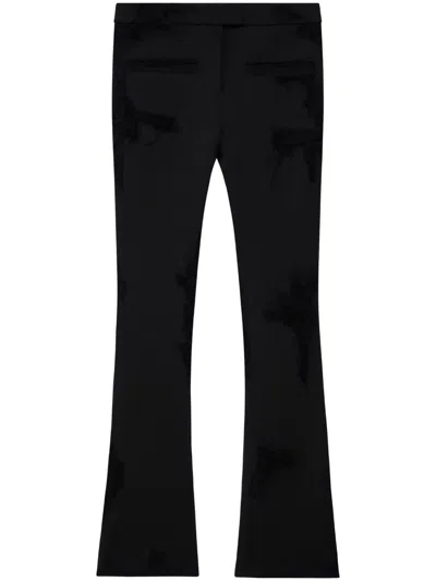 Courrèges Distressed-effect Flared Trousers In Brown