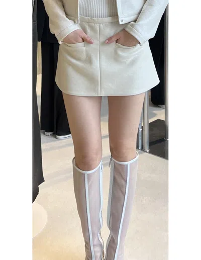 Courrèges Logo-appliqué Faux-leather Miniskirt In Gray