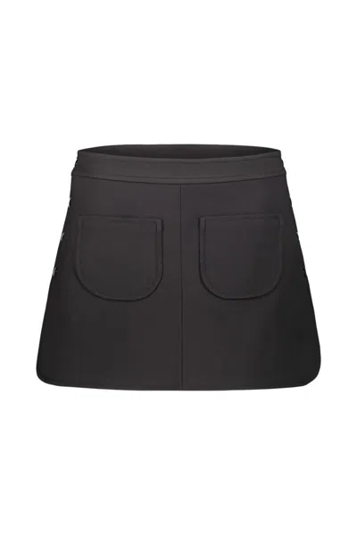 Courrèges Mini Skirt With Side Opening By Four Press, Patch Pockets On The Front. Clothing In Black