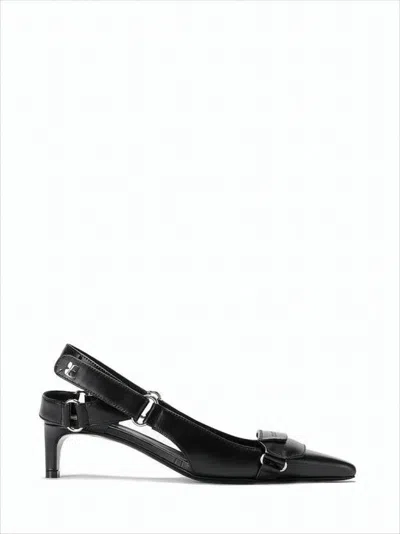 COURRÈGES POINTED TOE SLINGBACK PUMPS WITH ADJUSTABLE BUCKLE DETAIL