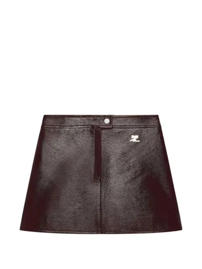 Courrèges Vinyl-effect Mini Skirt With Logo Patch In Brown