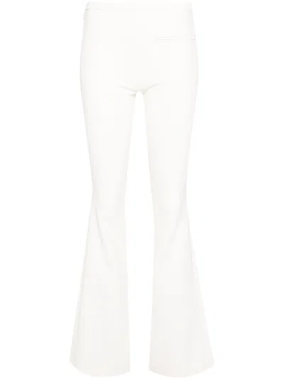 COURRÈGES LOGO-EMBROIDERED BOOTCUT TROUSERS - WOMEN'S - POLYURETHANE/POLYESTER/CUPRO
