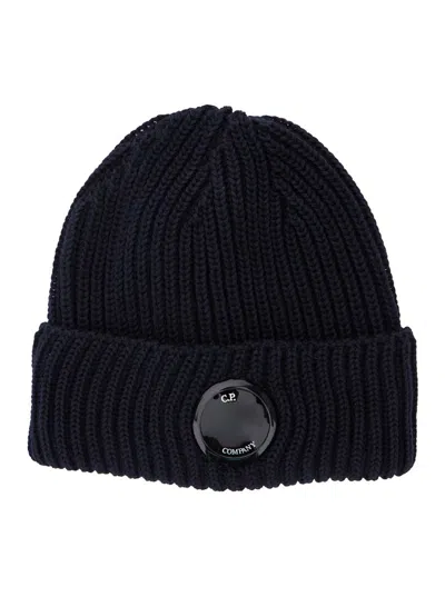 C.P. COMPANY BLUE KNIT BEANIE WITH LOGO PLAQUE ON THE FRONT IN WOOL MAN
