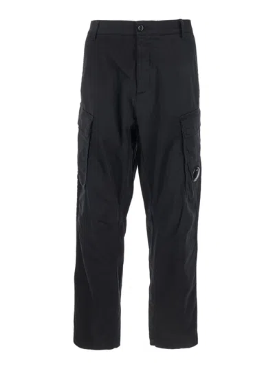 C.P. COMPANY BLACK PANTS WITH CARGO POCKETS AND LENS MOTIF ON THE LEG IN COTTON MAN