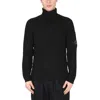 C.p. Company Ribbed Knit Roll Neck Sweater With Signature Lens Detail And Zip Pocket