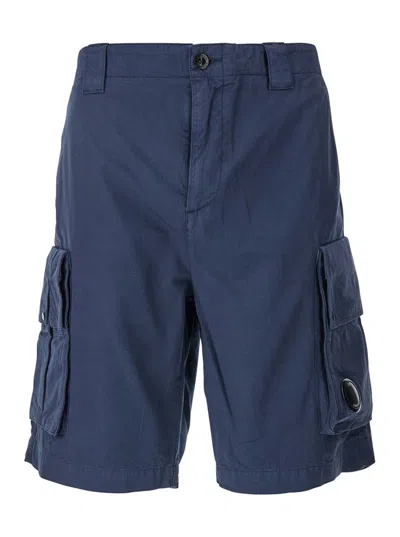 C.P. COMPANY BLUE BERMUDA PANTS WITH BELT LOOPS AND TWO MAXI PATCH POCKETS ON THE SIDE