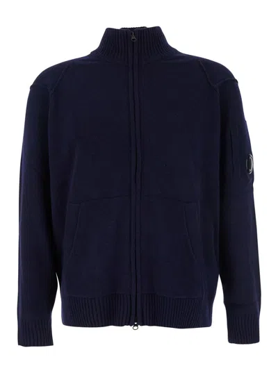 C.P. COMPANY BLUE JACKET WITH HIGH NECK AND LOGO PLAQUE ON THE SLEEVE IN WOOL BLEND MAN
