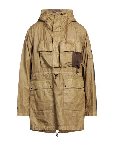 C.p. Company Overcoats In Yellow