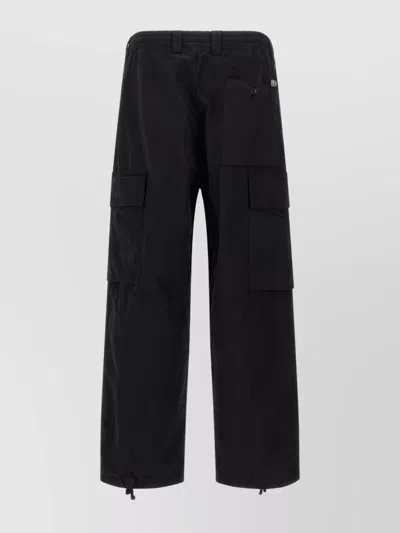C.P. COMPANY CARGO STYLE TROUSERS FEATURING ADJUSTABLE ELEMENTS