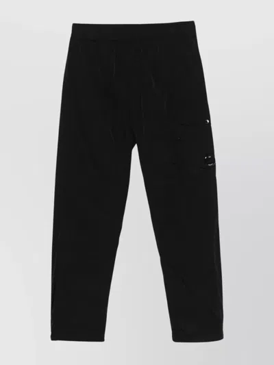 C.P. COMPANY CARGO TROUSERS WITH BUTTON DETAIL AND POCKETS