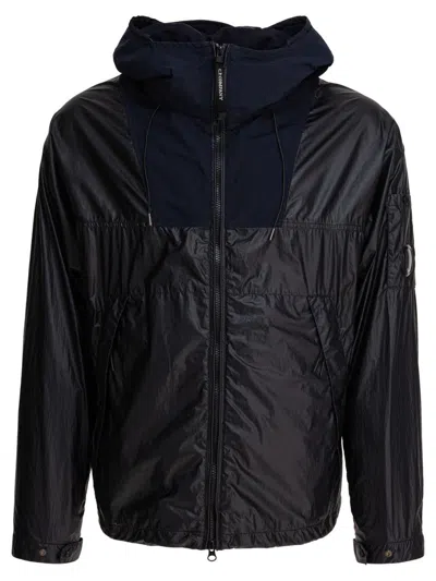 C.p. Company Hooded Jacket With Distinctive Lens Detail In Black