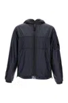 C.p. Company Hooded Windbreaker Jacket With Lens Detail In Blue