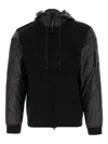 C.p. Company Men Black Jacket With Drawstring Hood And Logo Plaque On The Sleeve In Wool Man In Black