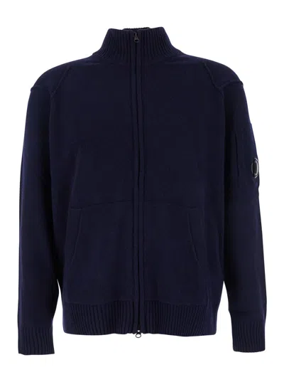 C.P. COMPANY BLUE JACKET WITH HIGH NECK AND LOGO PLAQUE ON THE SLEEVE IN WOOL BLEND MAN
