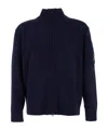 C.p. Company Blue Jacket With High Neck And Logo Plaque On The Sleeve In Wool Blend Man In Blue