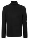 C.p. Company Ribbed Knit Roll Neck Sweater With Signature Lens Detail And Zip Pocket In Black
