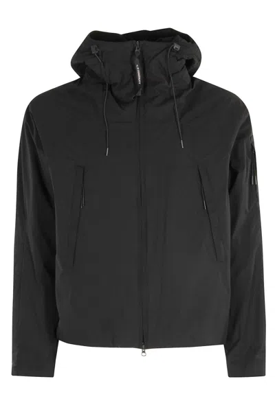 C.P. COMPANY SLEEK BLACK MEDIUM JACKET WITH ADJUSTABLE HOOD AND ZIPPERED POCKETS