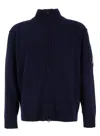 C.p. Company Blue Jacket With High Neck And Logo Plaque On The Sleeve In Wool Blend Man In Blue