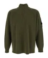 C.p. Company Men Green Turtleneck Sweater With Logo Plaque On The Sleeve In Wool Man In Green