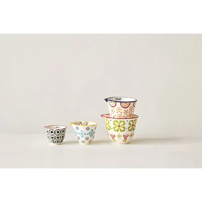 Creative Co-op Floral Hand Stamped Stoneware Measuring Cups In Blue;green;orange